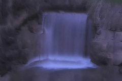 Time Ghosted Organically Blurred Garden Waterfall with Blue Tint Loop
