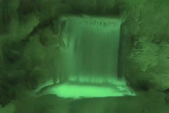 Time Ghosted Organically Blurred Garden Waterfall with Green Tint Loop