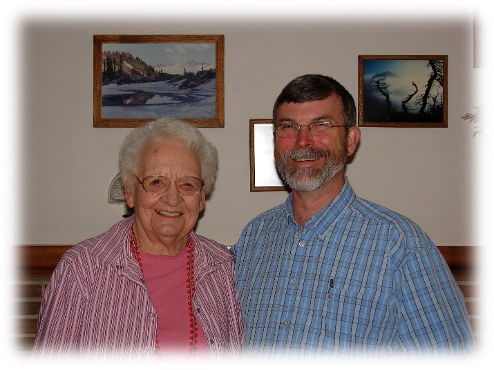 Grant & Ruth in front of the fireplace